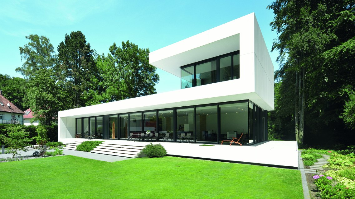 Minimal white house with large aluminium windows